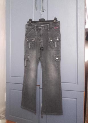 Нові чорні джинси на дівчинку 8-10років.