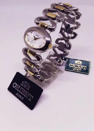 Часы женские наручные титановые с позолотой на  Orient FUBQN001W