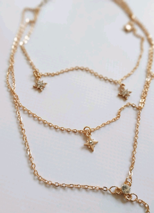 Ожерелье с камнями золотистое золотое колье брильянты каскад