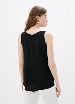 Очень красивая и стильная брендовая блузка чёрного цвета с рюш...