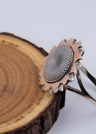 Кольцо серебряное "Подсолнух" с золотой напайкой 925/375 пробы.