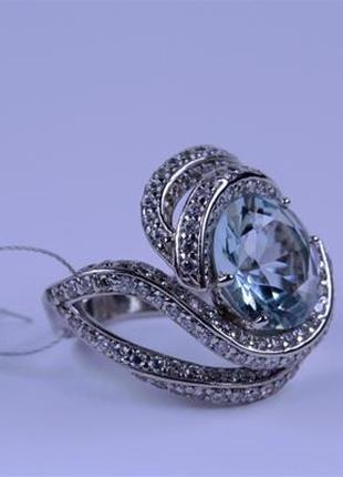 Кольцо серебряное с голубым алпанитом и фианитами 925 пробы.