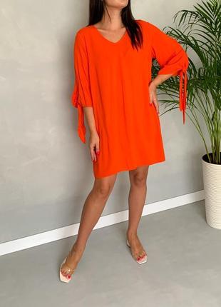 Оранжевое платье туника свободный крой.