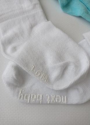Next. білі шкарпетки з закотом на 3-6 місяців.