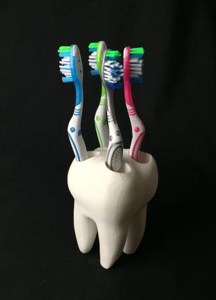 Підставка для зубних щіток у вигляді зуба