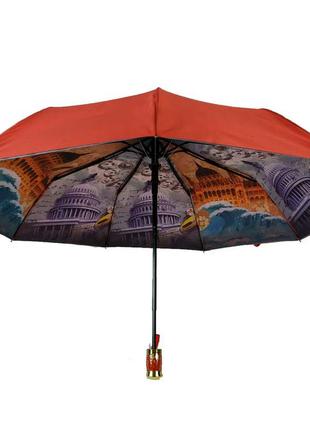 Зонт красный с двойным куполом и рисунком внутри.