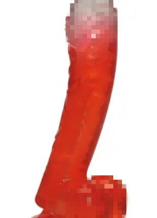 Красный фаллоимитатор в форме пениса с прозрачной головкой и м...