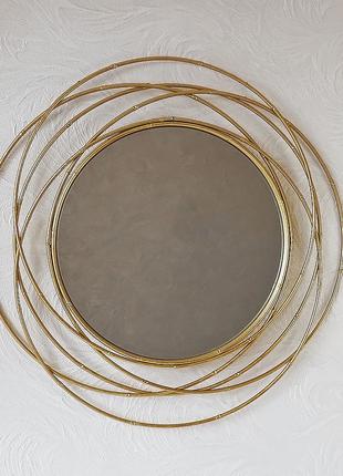 Настенное зеркало круглое из стекла и металла с золотой рамой ...