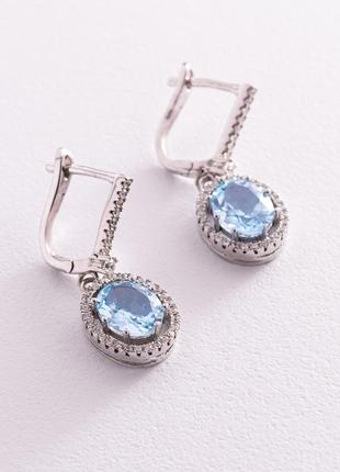 Срібні сережки з блакитними топазами і фіанітами 121355