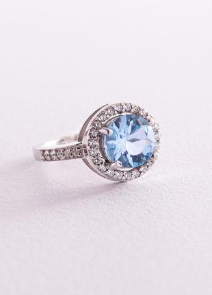 Серебряное кольцо с голубым топазом и фианитами 111430