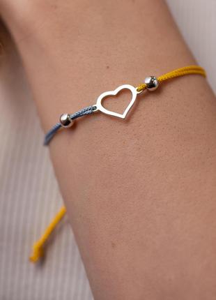 Серебряный браслет "Украинское сердце" (голубая и желтая нить)...