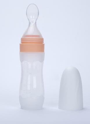 Бутылочка с ложкой силиконовая для кормления Персиковая BLQ12