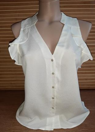 Блуза с воланами без рукавов
