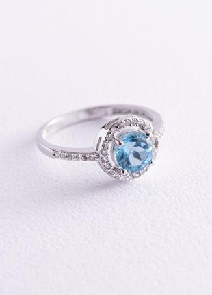 Золотое кольцо с голубым топазом и фианитам к04628