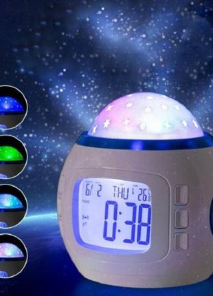 Музичний нічник-проектор зоряне небо 1038 з годинником та буди...