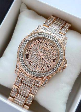 Файний жіночий годинник у кольорі рожеве золото, прикрашений к...