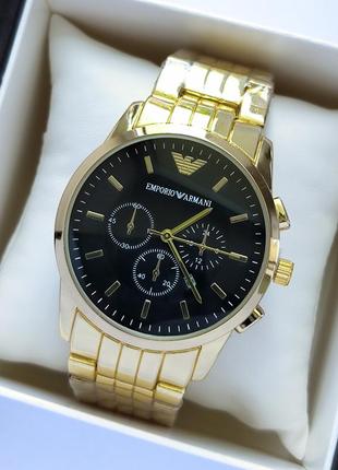 Красивые мужские наручные часы золотого цвета с черным цифербл...
