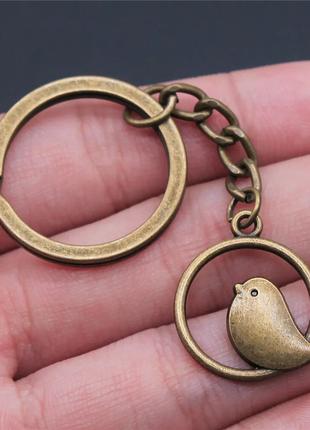 Брелок металлический бронзовый для ключей "Птица в кольце"