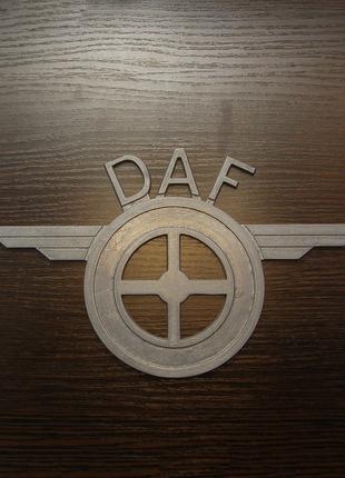 Емблема DAF з ресорами