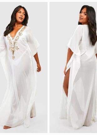 Біла з прикрасою сукня балахон