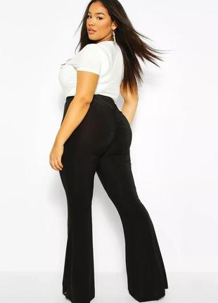 Жіночі еластичні чорні брюки кльош