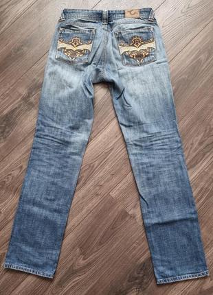 Продам женские джинсы с вышитыми карманами р.44-46