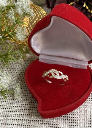 Серебряное кольцо с золотыми напайками и фианитами