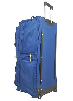 Дорожняя тканевая сумка на колесах 110 л синяя с ручкой 76х37х...