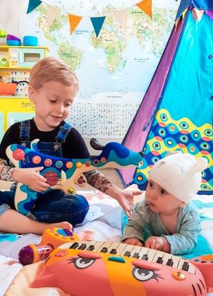 Игрушка Пес-гитарист для музыкального образования детей