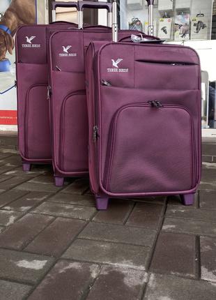 Набор чемоданов THREE BIRDS Фиолетовый на два колесах