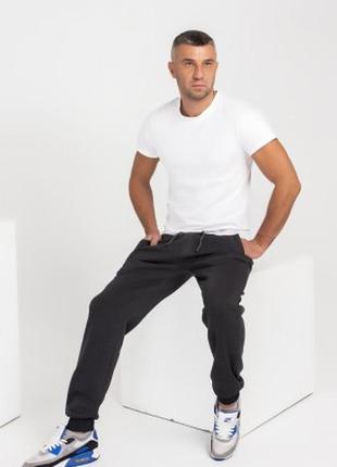 Темно-сірі утеплені флісом спортивні штани з манжетами