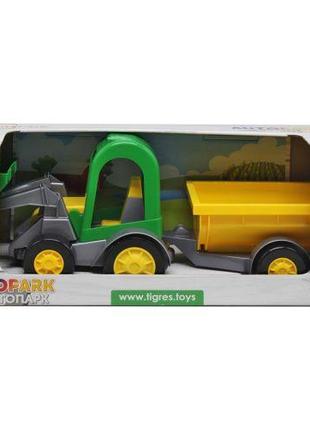 Трактор-баггі з ковшем і жовтим причепом