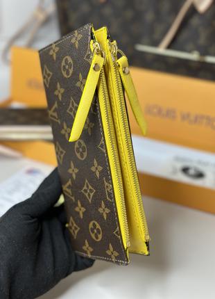 Женский кошелек Louis Vuitton на змейке.
