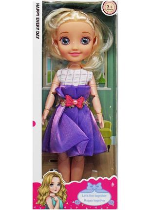 Кукла малышка в фиолетовом платье