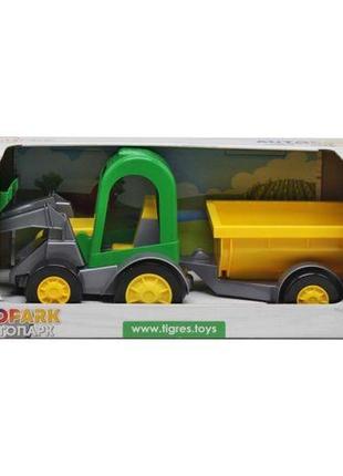 Трактор-баггі з ковшем і жовтим причепом