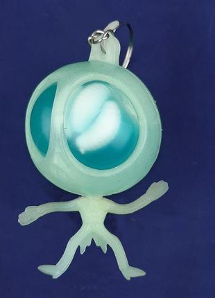 Игрушка антистресс гуманоид с червями светонакопительный голубая