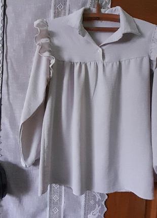Блуза с воланами жатка