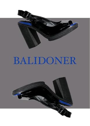 На фото зображені чорні туфлі на шпильці з брендом BALIDONER.