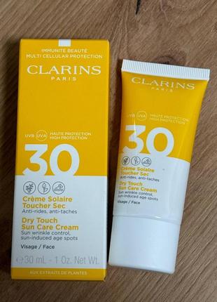 Clarins dry touch sun care cream - солнцезащитный крем для лиц...