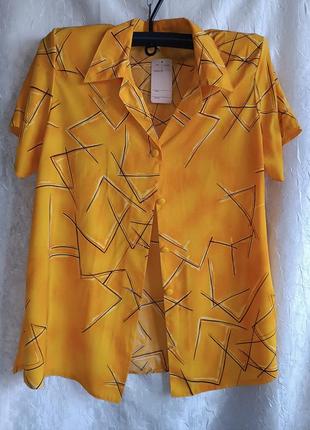 Женская легкая кофточка блузка с коротким рукавом.
цвет ярко-ж...