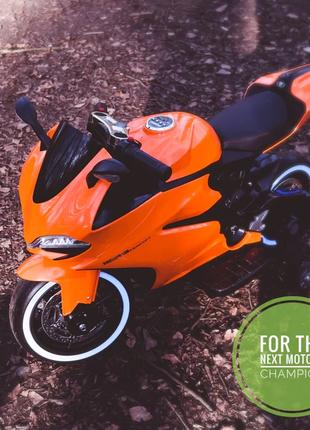 Детский электромотоцикл Ducati (оранжевый цвет) с подсветкой к...