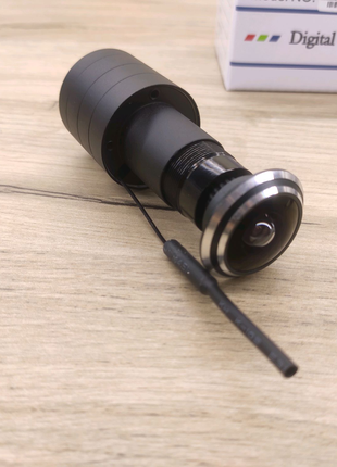 Камера видеонаблюдения в глазок 2Mpx с WiFi