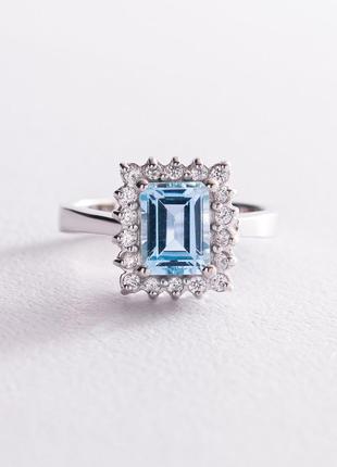 Серебряное кольцо с голубым топазом и фианитами 111448