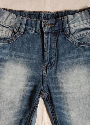 Светло синие тертые  джинсы yigga германия на10 лет (140см)