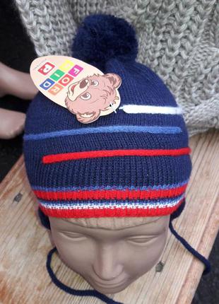 Детские демисезонные вязаные шапки на завязках с помпоном для ...