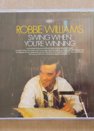 Музыкальный CD диск. Robbie Williams - Swing When You're Winni...