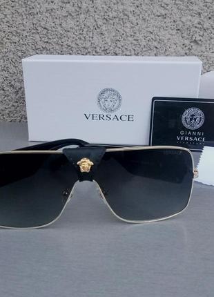 Versace очки женские солнцезащитные черные в золотой металличе...